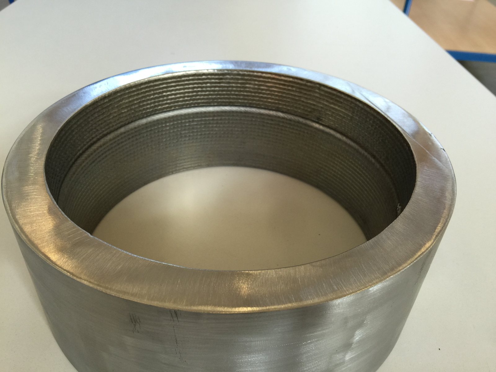 Inconel 625 cladding being welded inside a steel pipe